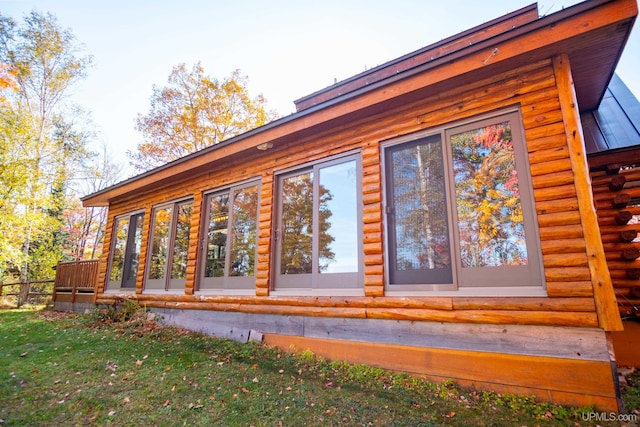 view of side of property featuring a yard