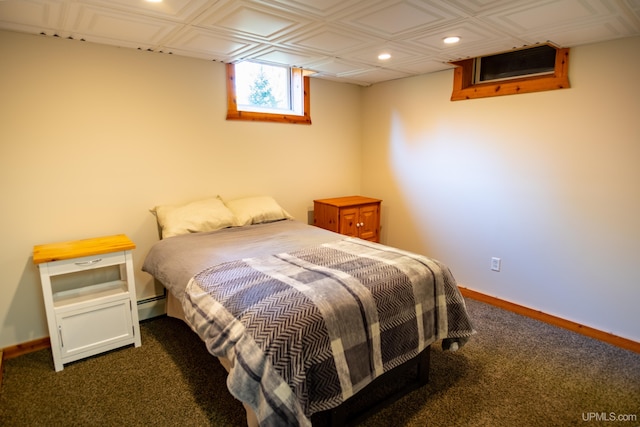 bedroom with dark colored carpet