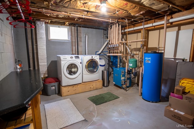 basement featuring gas water heater and washer and clothes dryer