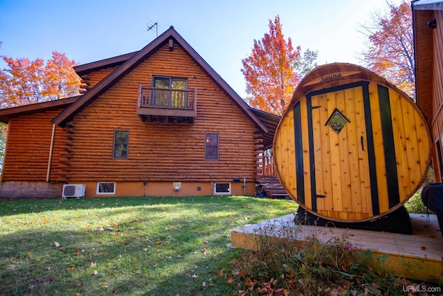 view of side of property with a lawn