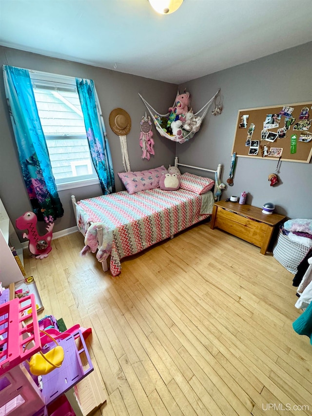 bedroom featuring hardwood / wood-style flooring