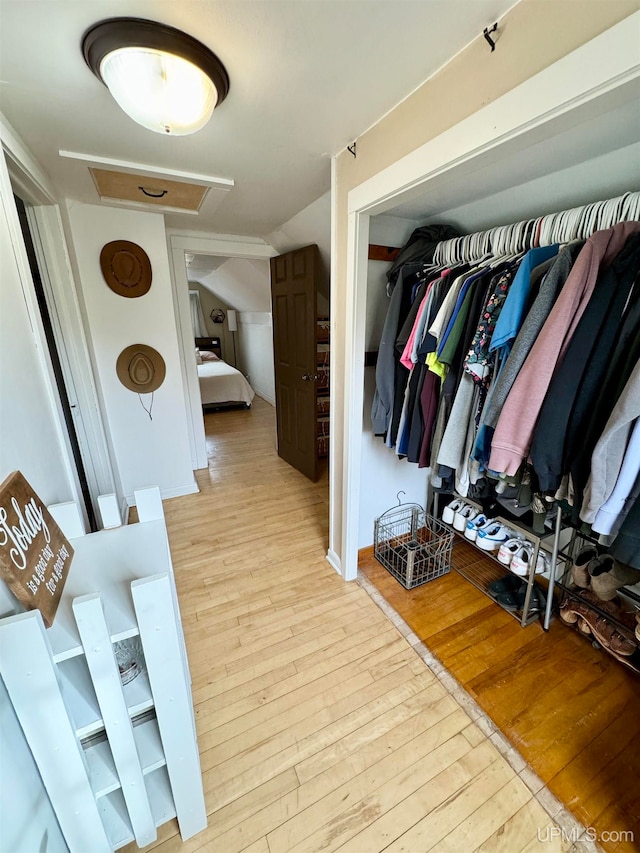 spacious closet featuring light hardwood / wood-style flooring