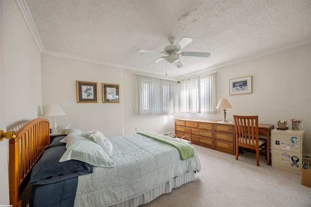 carpeted bedroom featuring ornamental molding, a textured ceiling, and ceiling fan