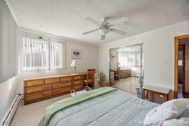 carpeted bedroom with a baseboard radiator, ceiling fan, a textured ceiling, crown molding, and a closet