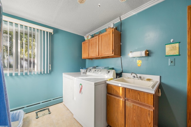 laundry room featuring independent washer and dryer, a textured ceiling, a baseboard radiator, and cabinets