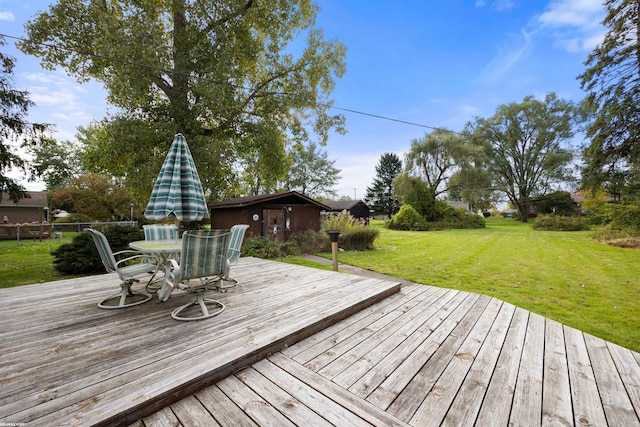 wooden terrace with a yard