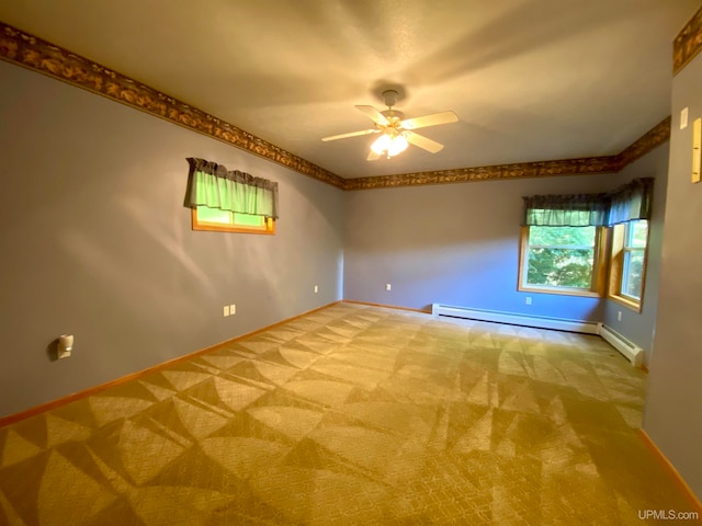 empty room with a baseboard heating unit, light colored carpet, and ceiling fan