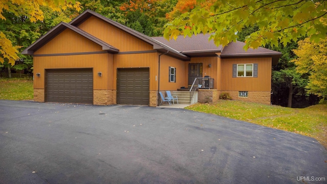 view of front of house with a front lawn and a garage