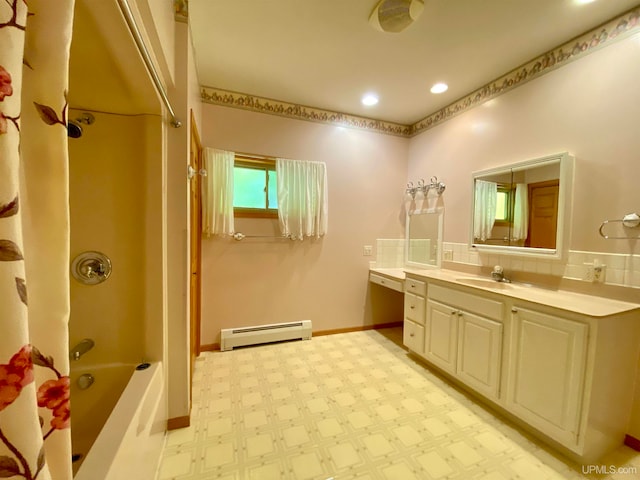 bathroom with vanity, a baseboard radiator, and shower / tub combo