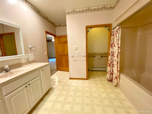 bathroom featuring vanity, shower / bath combination with curtain, and a baseboard heating unit