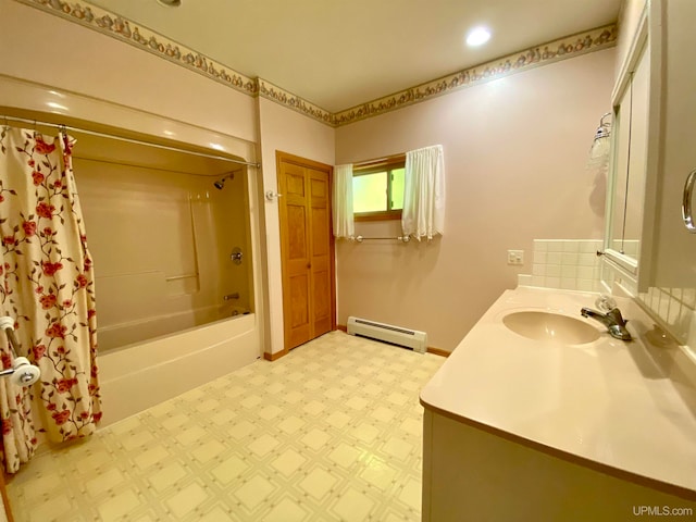 bathroom featuring vanity, shower / bath combo, and a baseboard radiator