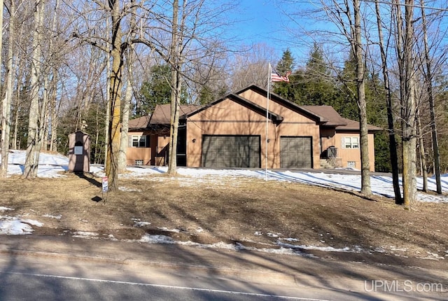 exterior space featuring a garage and driveway