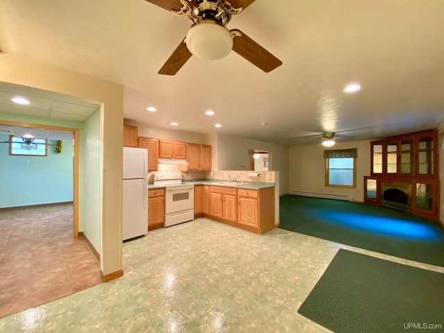 kitchen with plenty of natural light, sink, a baseboard radiator, and white appliances