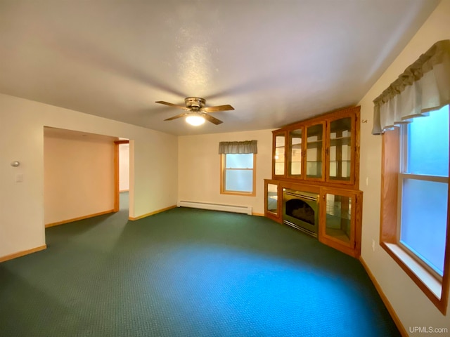 unfurnished living room featuring ceiling fan, baseboard heating, and dark carpet