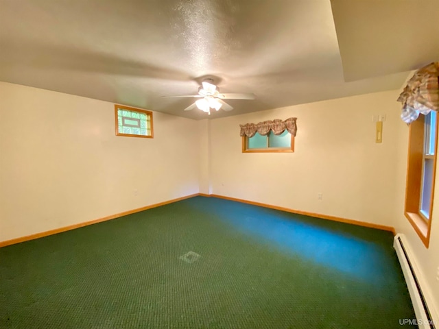 unfurnished room featuring carpet floors, a baseboard radiator, and ceiling fan