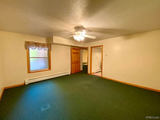 carpeted spare room with a baseboard heating unit and ceiling fan