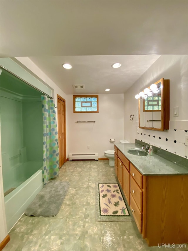 bathroom featuring a baseboard heating unit, vanity, visible vents, toilet, and shower / bath combo with shower curtain