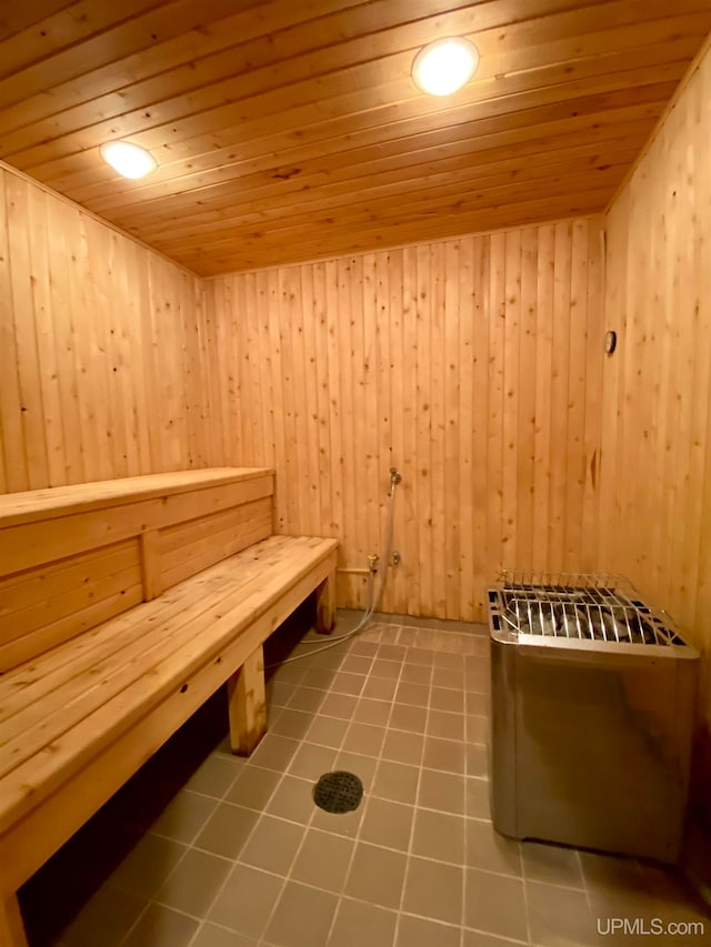 view of sauna featuring wood walls and wooden ceiling