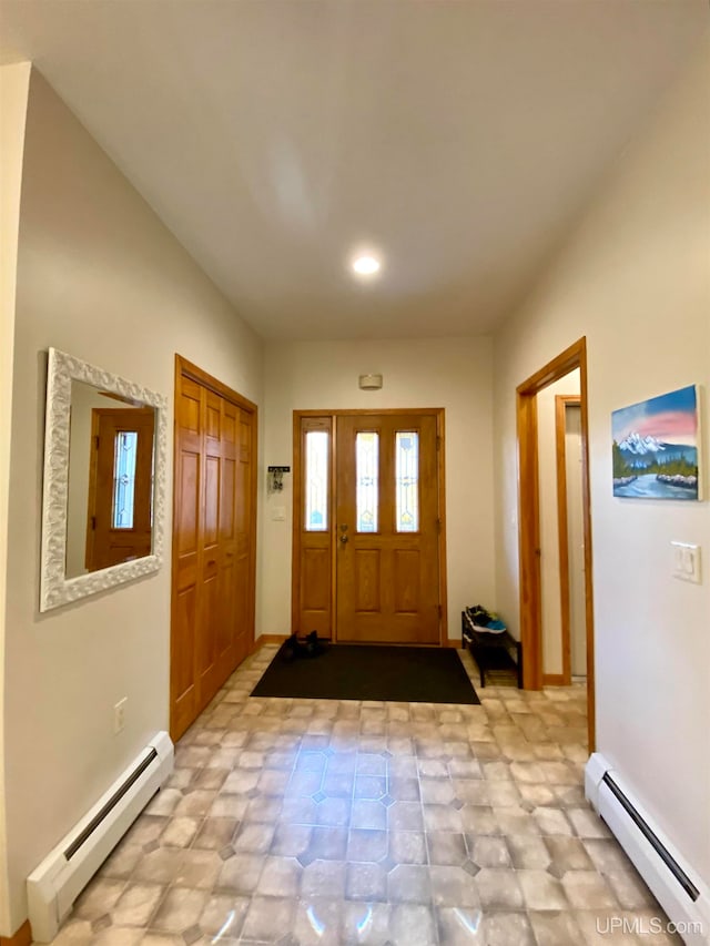 entryway featuring a baseboard heating unit