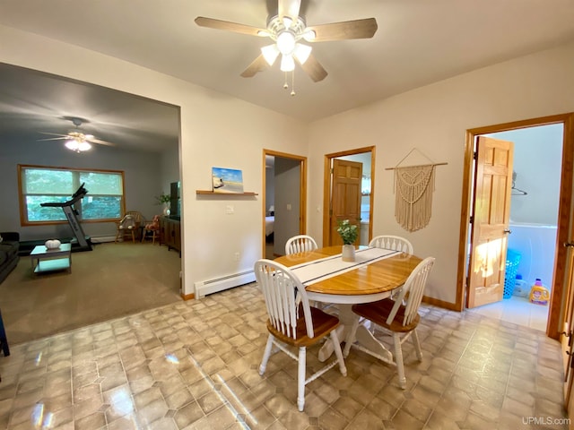 carpeted dining space featuring baseboard heating and ceiling fan