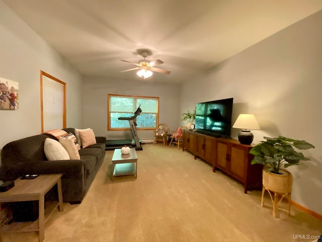 carpeted living room with ceiling fan