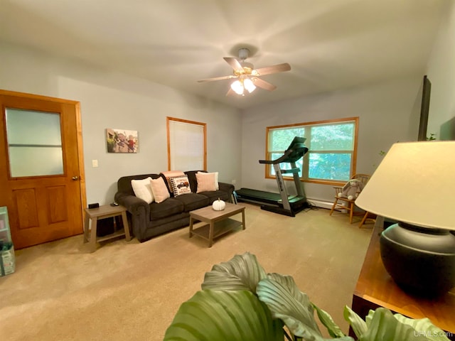 living room featuring light colored carpet and ceiling fan