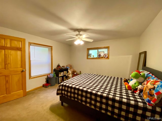 bedroom with light colored carpet and ceiling fan