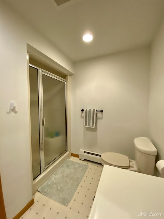 full bathroom with toilet, tile patterned floors, a stall shower, a baseboard heating unit, and baseboards