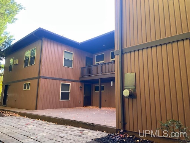 view of side of property featuring a patio