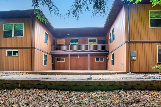 rear view of property with a balcony
