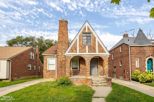 tudor house with a front yard