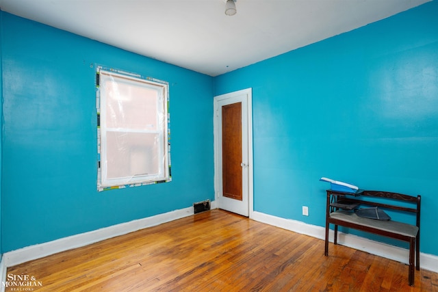 empty room with wood-type flooring