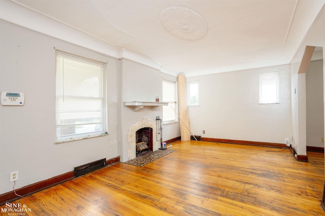 unfurnished living room with wood-type flooring