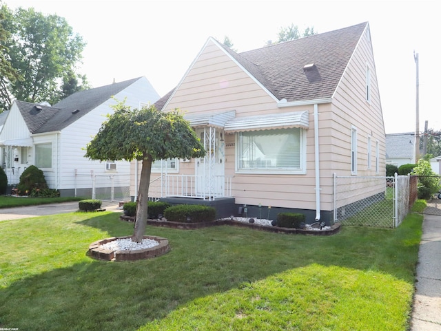 bungalow-style house with a front yard