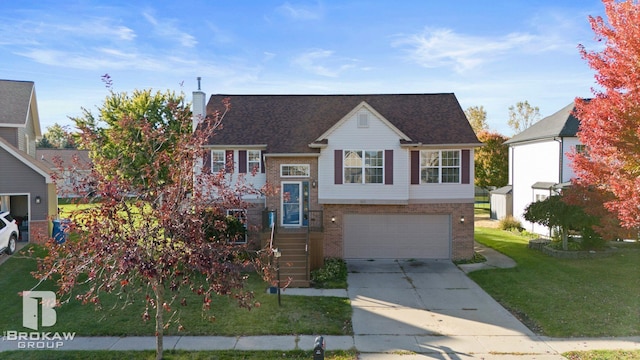 view of front of house with a front yard and a garage