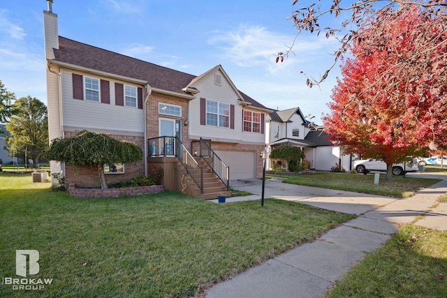 raised ranch featuring central air condition unit, a front yard, and a garage