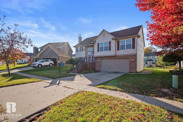 view of front of property with a front yard and a garage