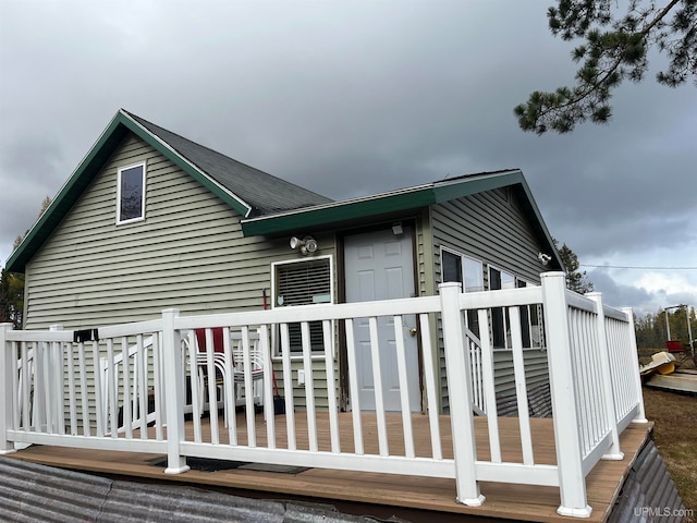 view of home's exterior featuring a wooden deck