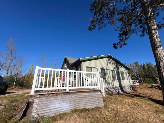 rear view of property with a deck