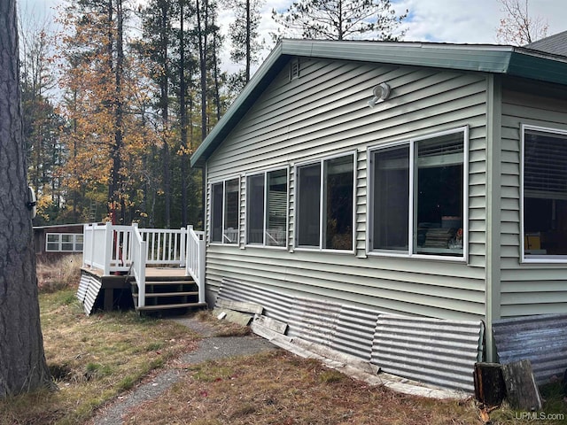 view of side of home featuring a deck