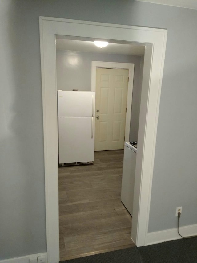 hallway featuring wood-type flooring