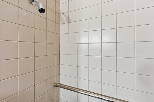 bathroom with tiled shower