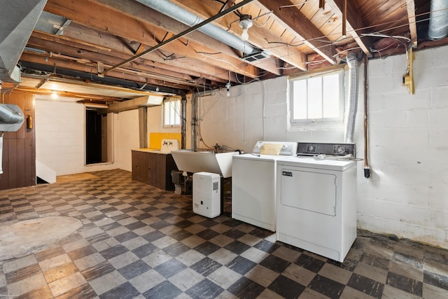 washroom with sink and washing machine and dryer