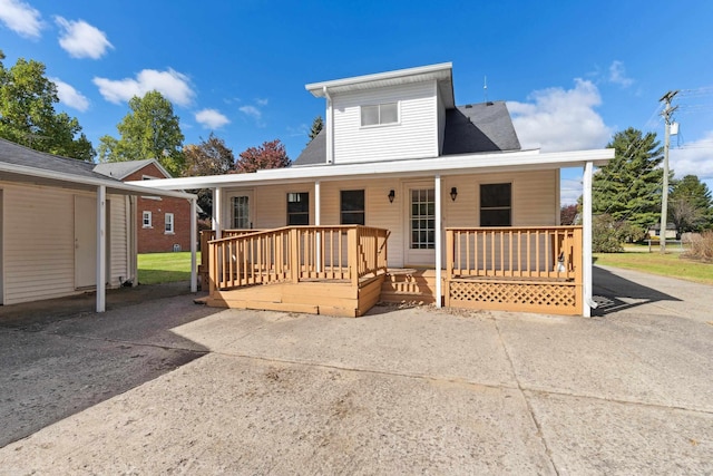 view of front of property featuring a porch and a wooden deck