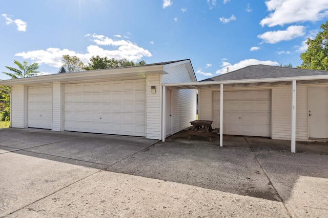 garage featuring a carport