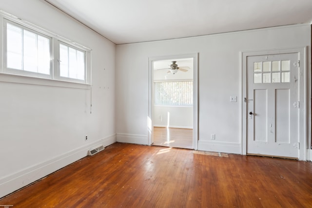 foyer entrance with ceiling fan and hardwood / wood-style flooring