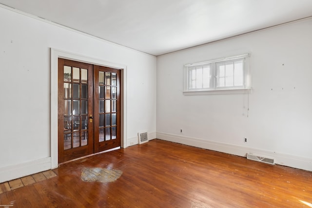 unfurnished room with french doors and hardwood / wood-style floors