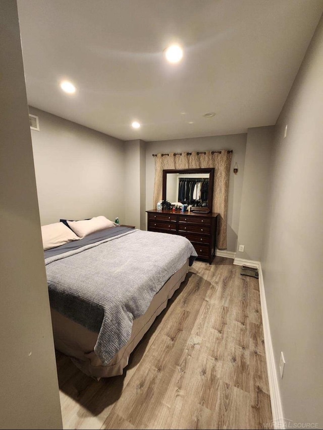 bedroom with light wood-type flooring