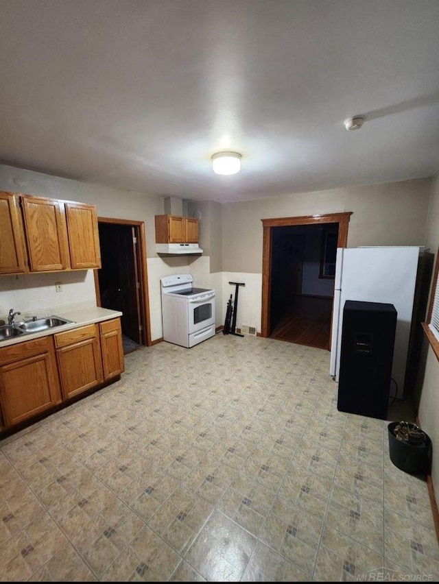 kitchen featuring sink and white electric stove