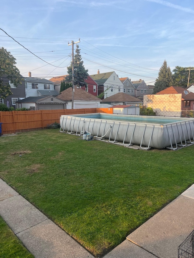 view of yard featuring a fenced in pool